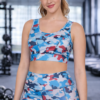 Woman wearing sky blue camo sports bra with removable cups during gym workout lifestyle shot