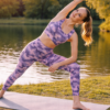 High waist gym leggings with mobile pocket in pink black camo during yoga pose