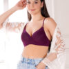 Model wearing wine underwired push up level 1 bra with satin edges and dori straps