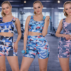 Women’s high-waist cycling shorts and sports bra set in camouflage prints for gym workouts